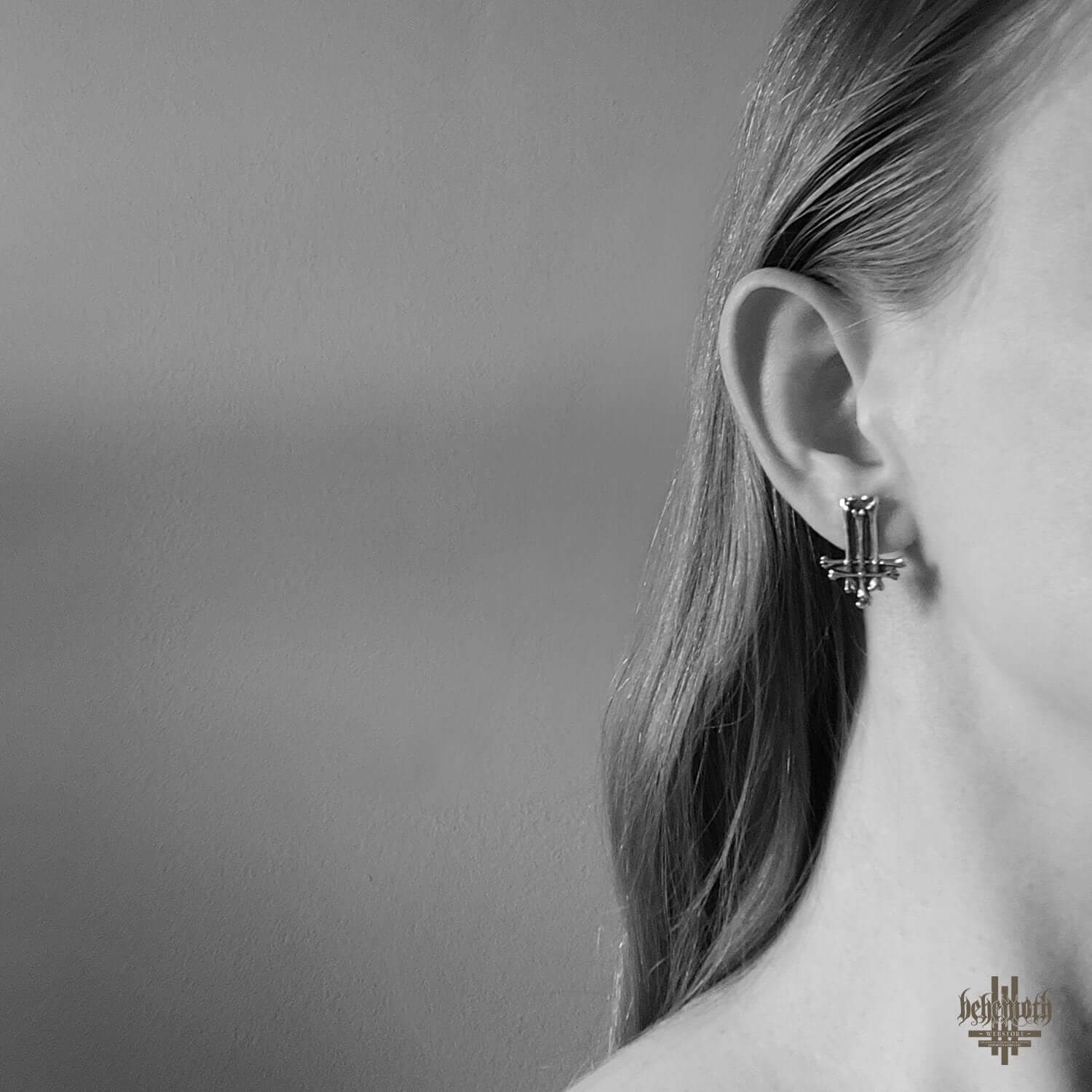 Sterling silver stud earring by Anna Mazon, showcased on ear, featuring dark oxidized finish and intricate handmade details.