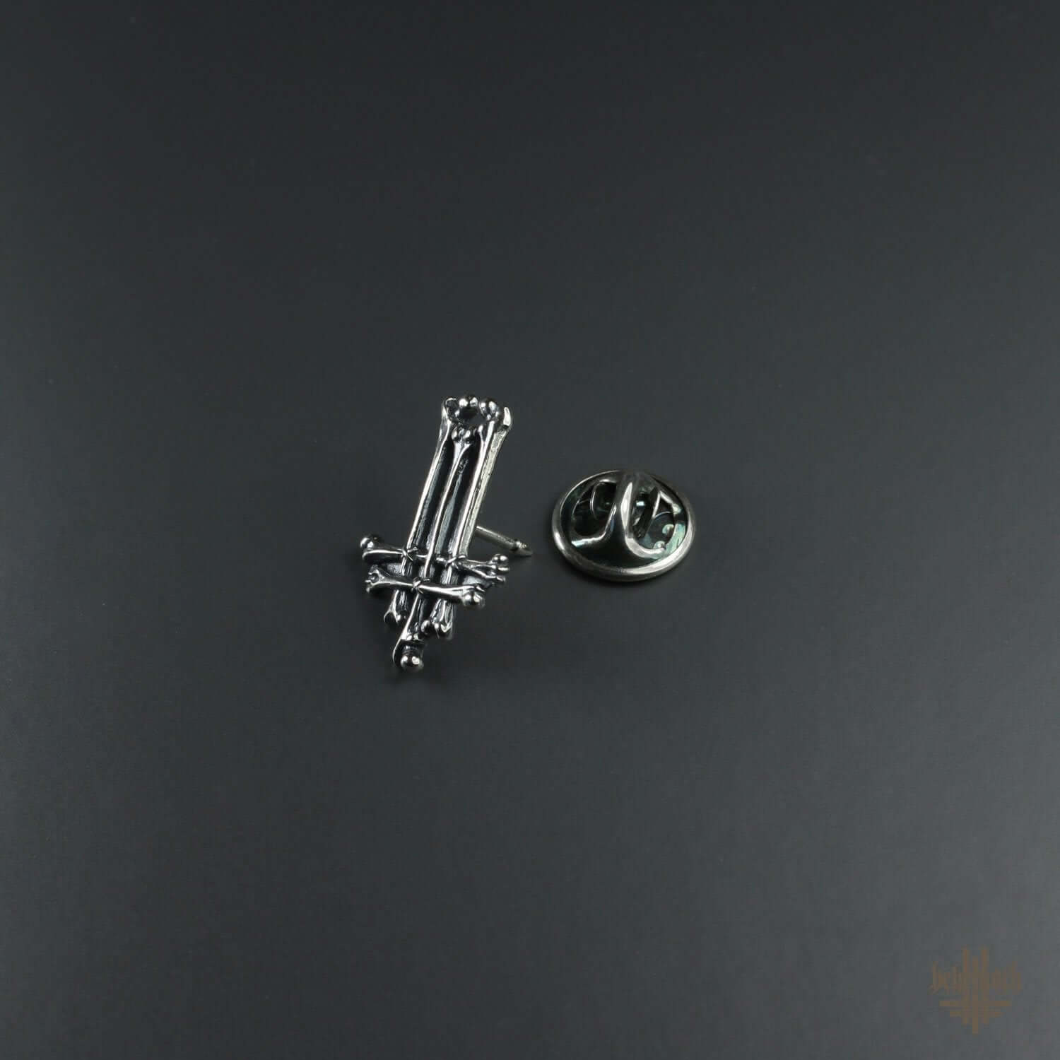 Dark detailed sterling silver pin with bones design, handcrafted and oxidized for unique detail, by Anna Mazon Jewellery.