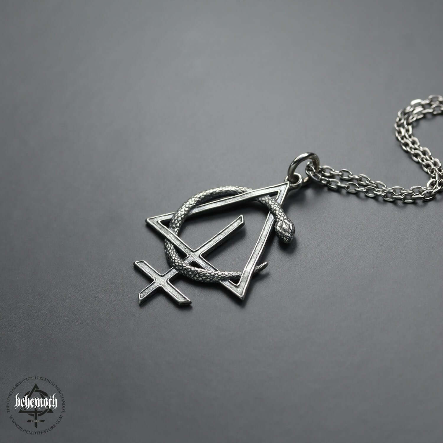 Sterling silver Behemoth 'CONTRA' necklace with dark, sculpted pendant by Anna Mazon, featuring openwork design on chain.