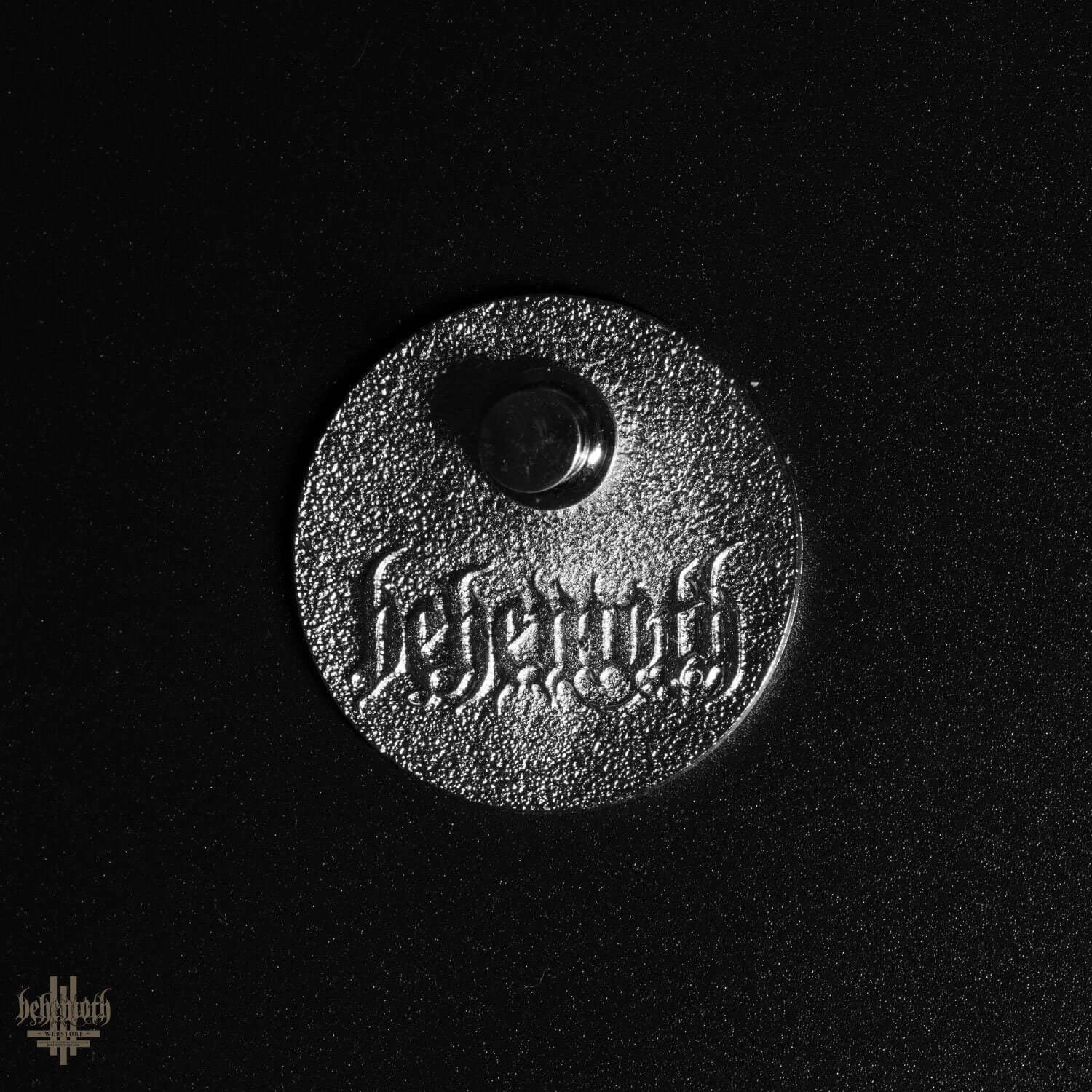 Backside view of Behemoth 'Contra' enamel pin with engraved logo, diameter 3.5 cm, showcasing high-quality craftsmanship.