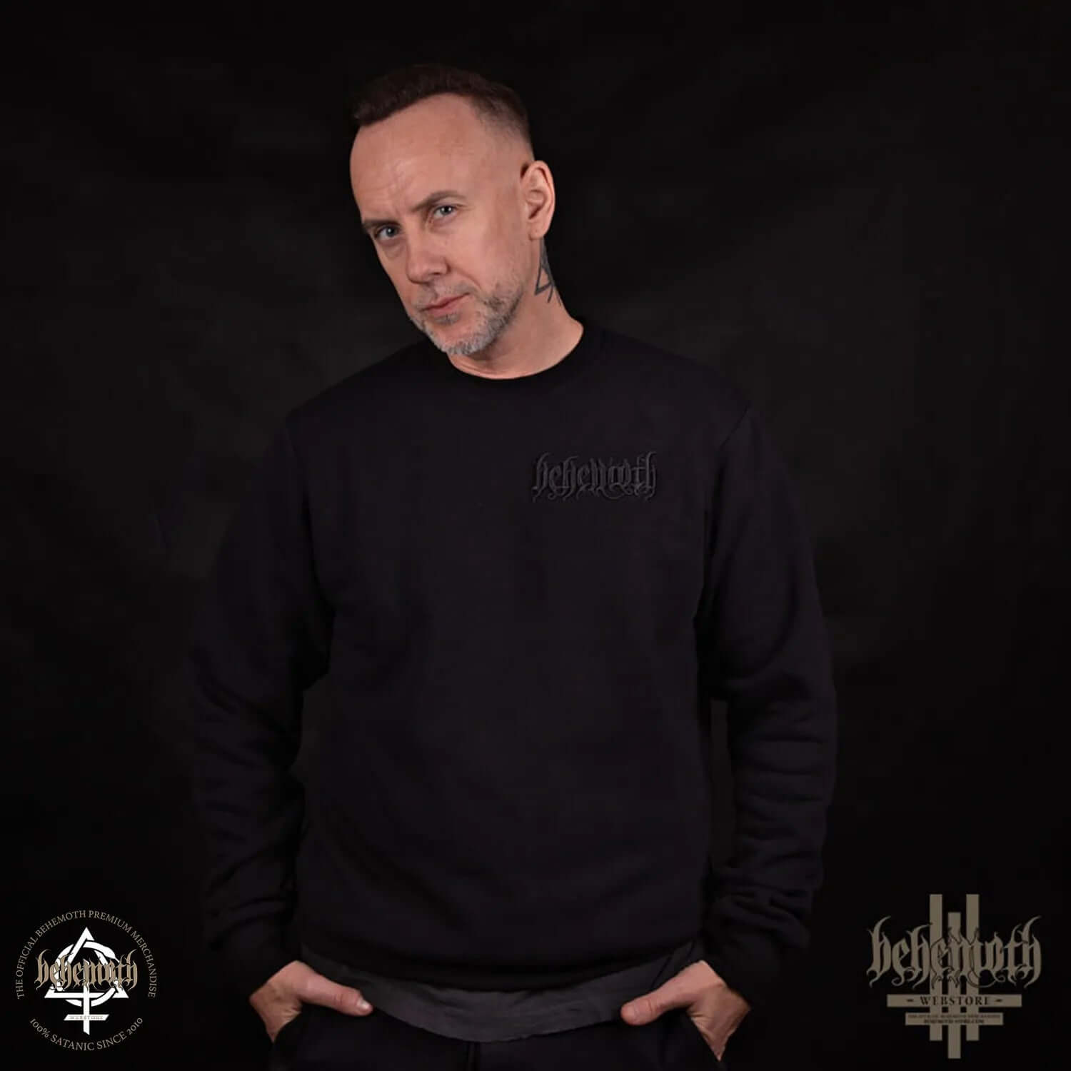 Man wearing black crewneck sweatshirt with embroidered Behemoth Logo on the chest, made in Poland, showcasing premium quality and durability.