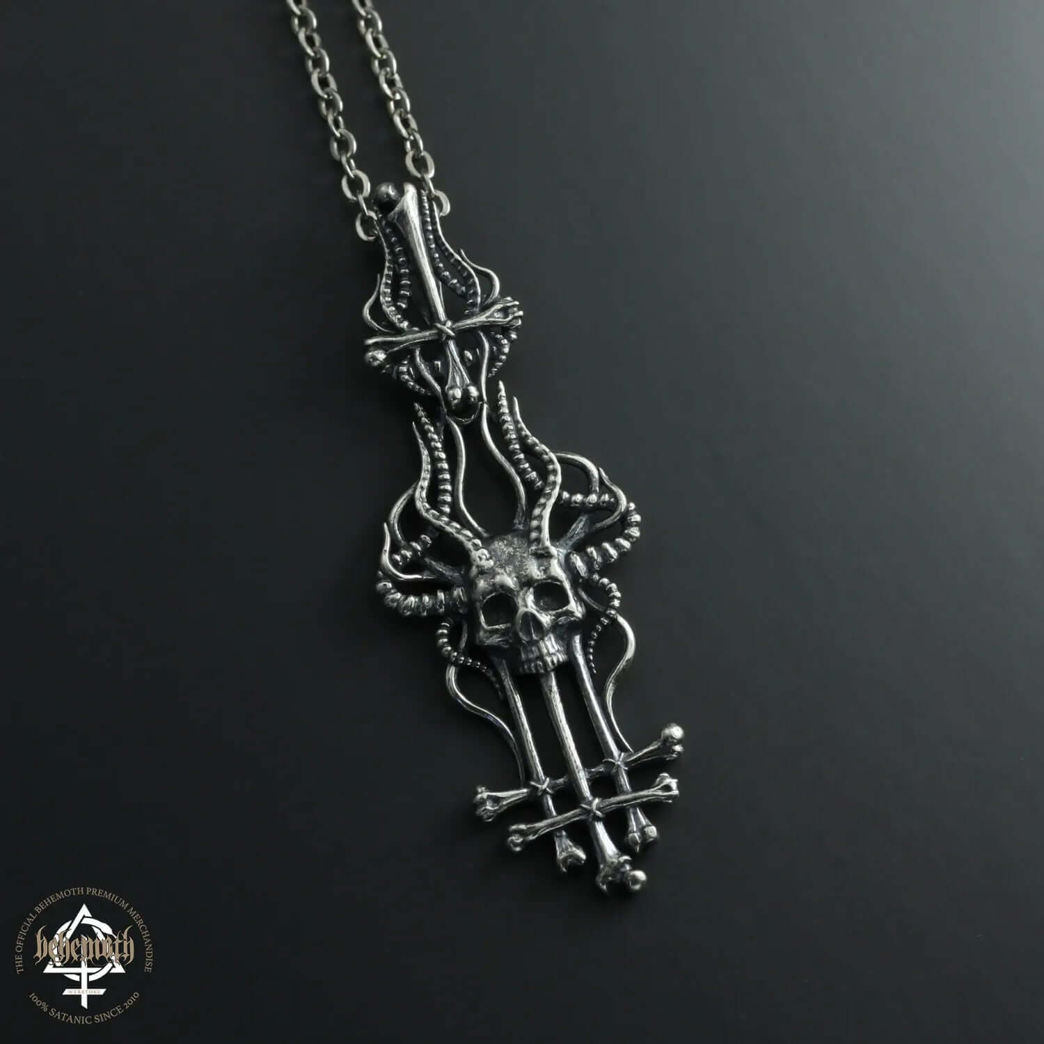 Sterling silver Behemoth 'In Absentia Dei' pendant with skull design, crafted using lost wax technique; hand-polished and oxidized.