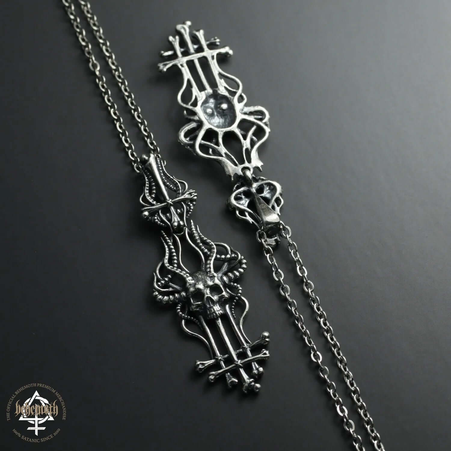 Sterling silver 'In Absentia Dei' necklace with dark oxidized details by Anna Mazon, featuring intricate openwork design.