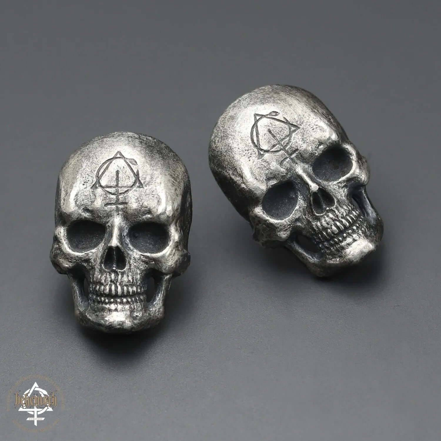 Behemoth 'Contra Skull' sterling silver stud earrings, dark oxidized, detailed skull design, handcrafted with lost wax technique.