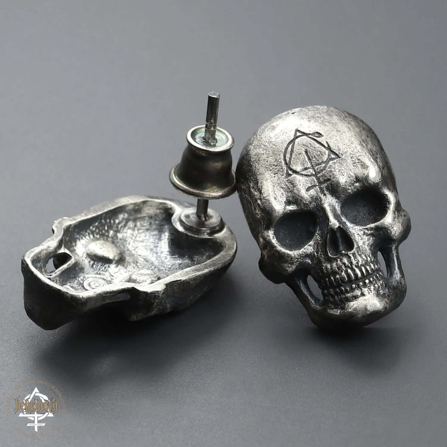 Behemoth 'Contra Skull' sterling silver stud earrings with oxidized finish, hand sculpted using ancient lost wax technique.
