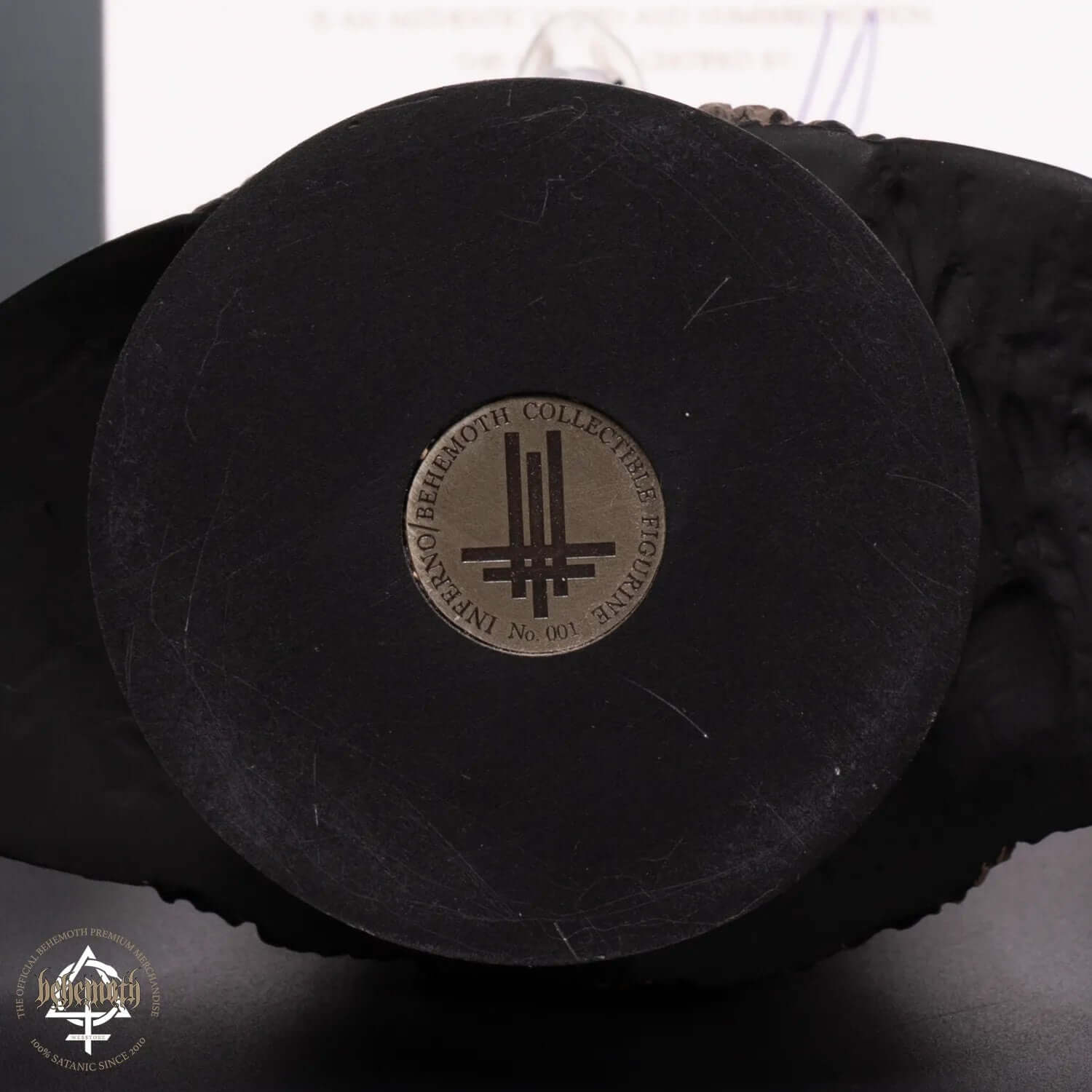 Unique numbered base of collectible Inferno/Behemoth figurine with engraved Trivmviratvs metal coin.