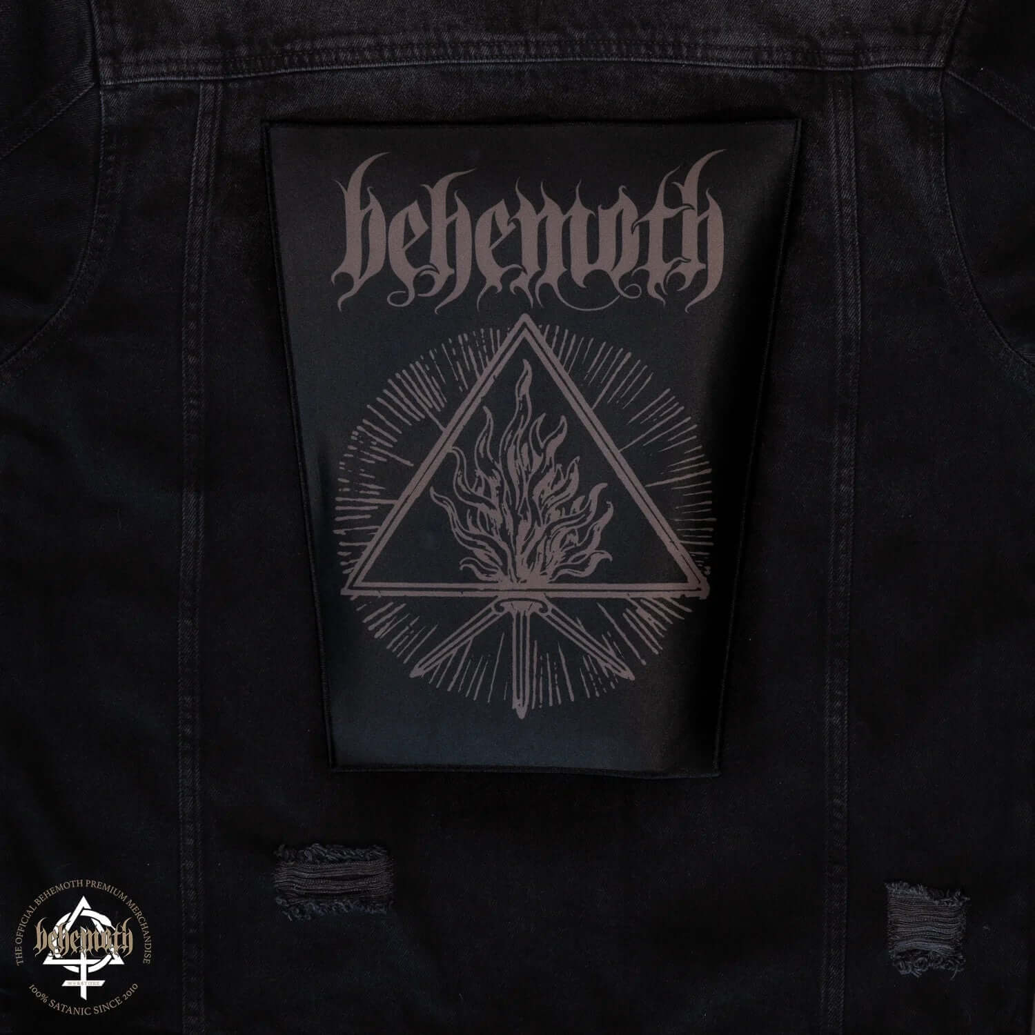 Behemoth 'The Unholy Trinity' iron-on backpatch displayed on a black denim jacket, featuring a printed triangular flame design.