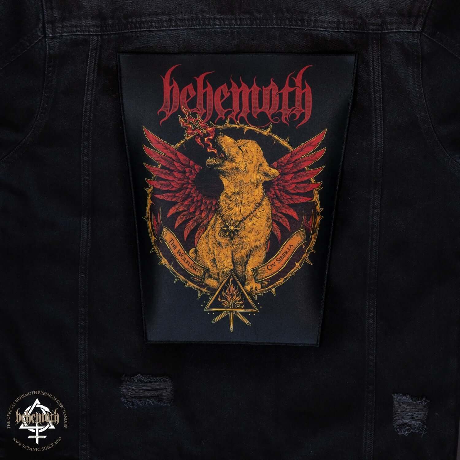 Behemoth 'The Wolfling Ov Siberia' iron-on backpatch on black jacket, featuring red and gold design with wings and wolf illustration.