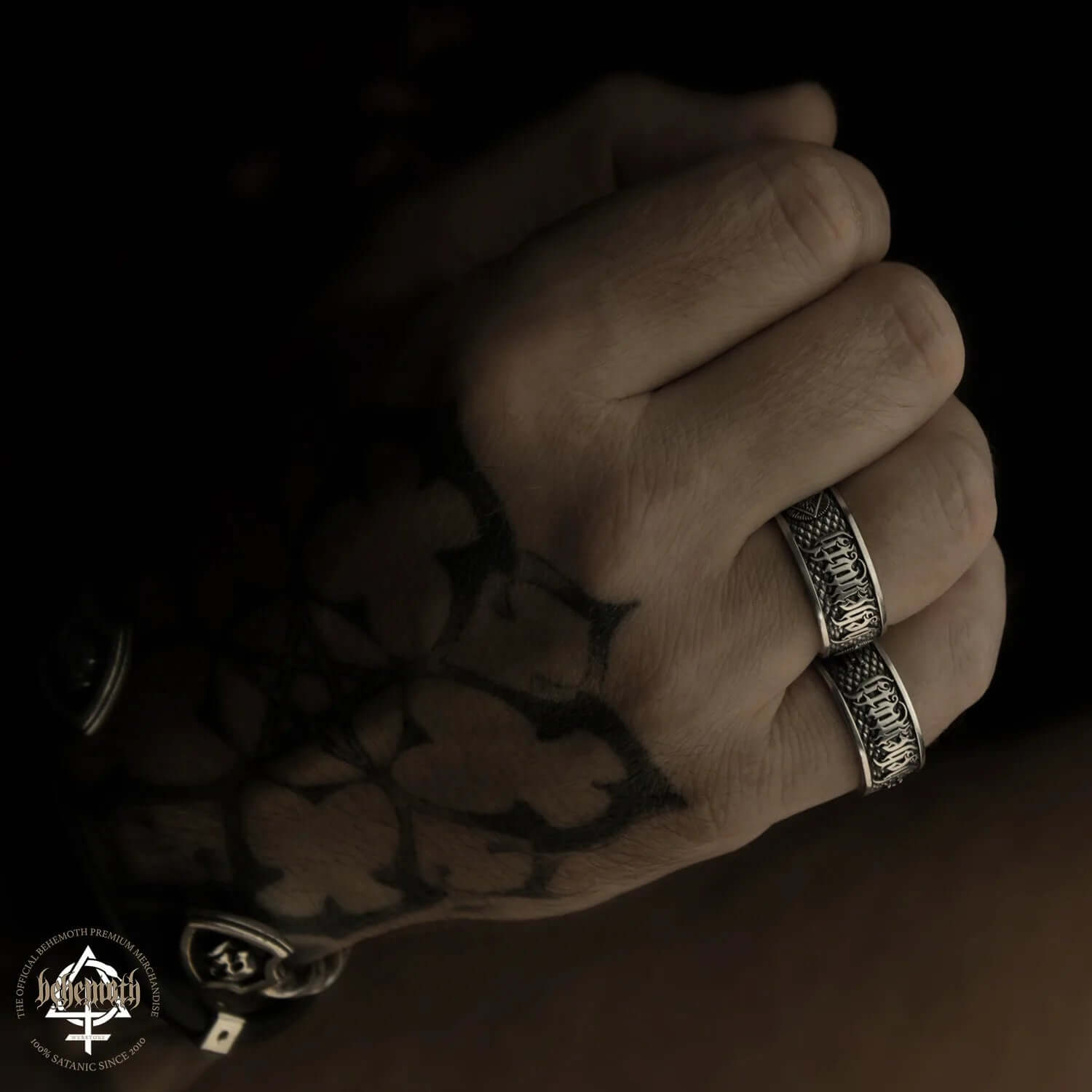 Behemoth 'Contra' Sterling Silver Ring by Tyvodar on a tattooed hand, available for preorder.