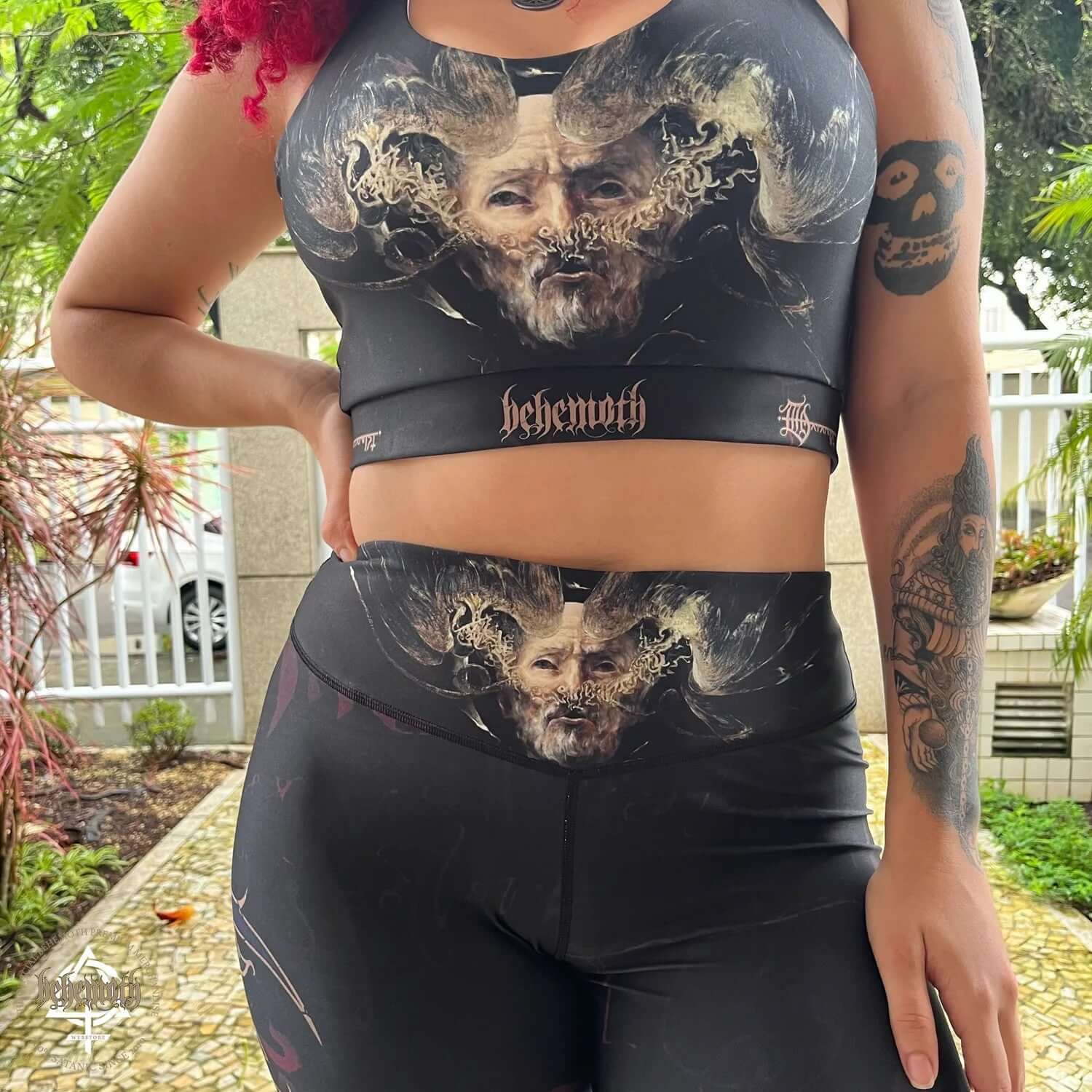 Woman wearing Behemoth 'The Satanist' sports bra with Dani Batista print, designed for running, yoga, gym, and fitness activities.