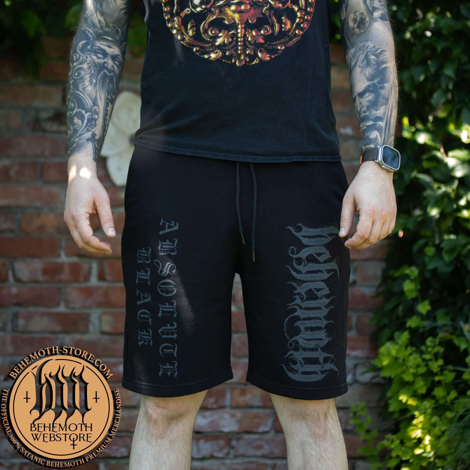 Man wearing Behemoth 'Absolvte Black' sweatpants, featuring bold screen-print design.