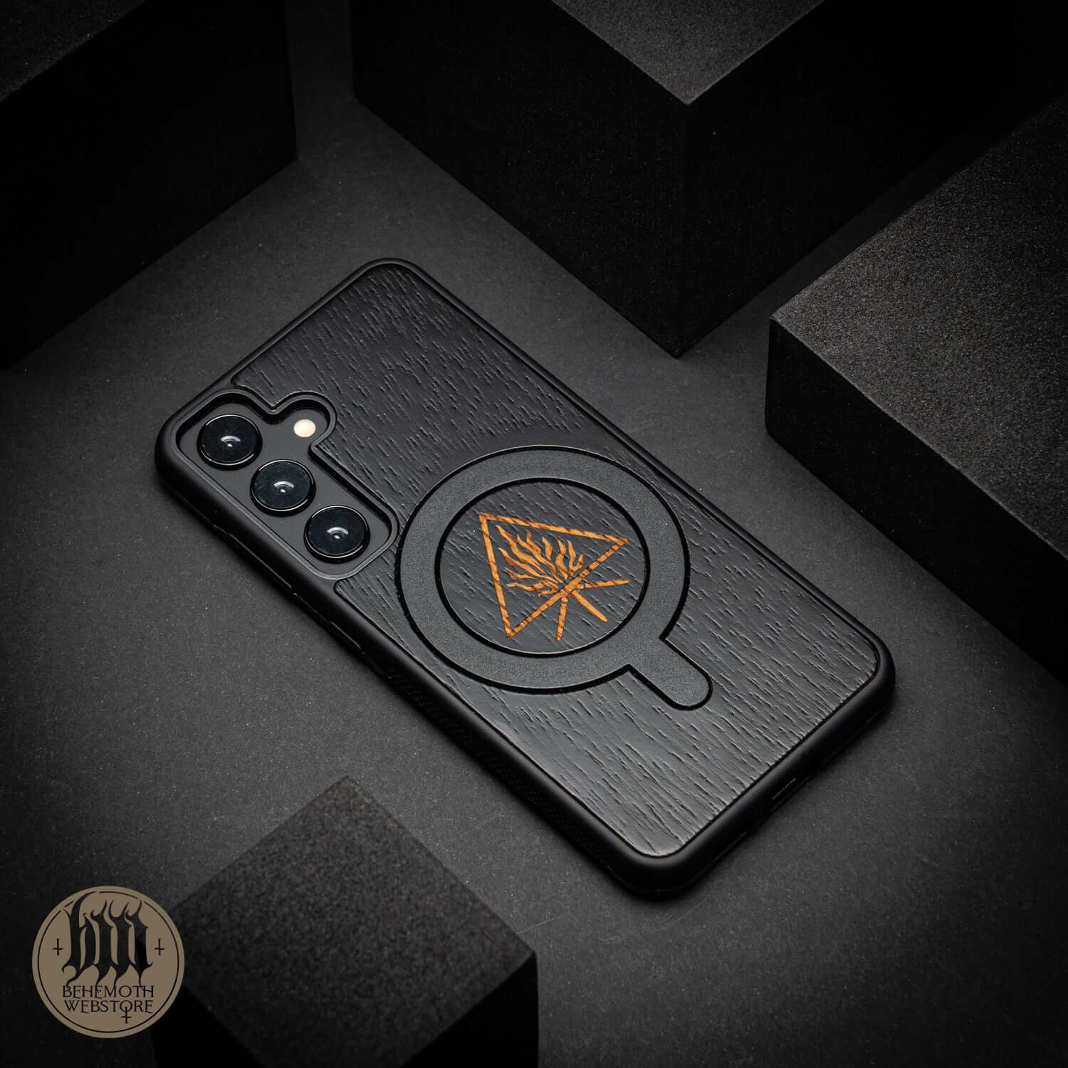 Behemoth 'The Unholy Trinity' black oak MagSafe phone case with silicone TPU, crafted in Poland.
