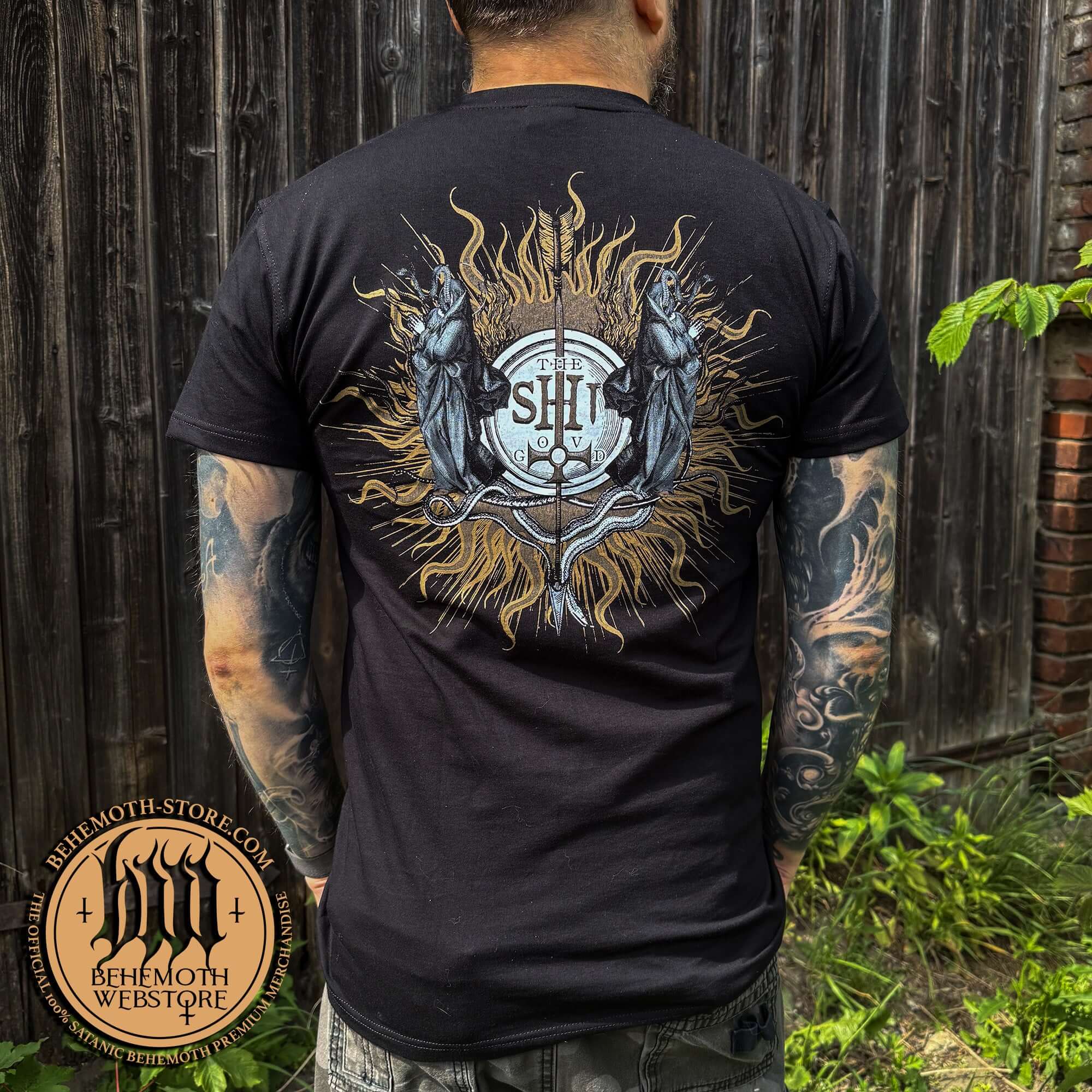 Man wearing Behemoth 'I Reign In Hell' T-Shirt with TSOG graphics, premium cotton, showcasing heavy metal band merchandise.