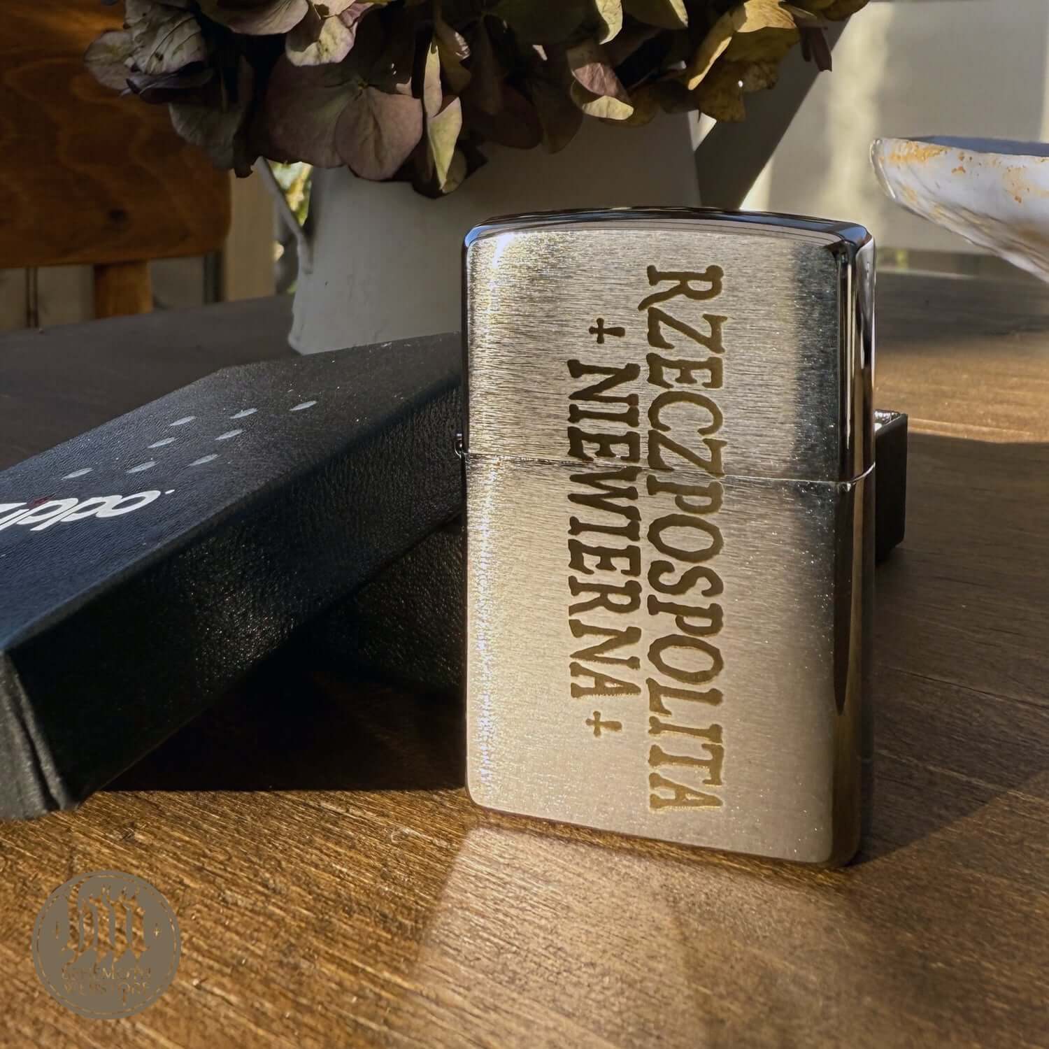 Behemoth 'Republic of the Unfaithful' Zippo lighter with laser-engraved design on brushed chrome, exclusive to official band store.