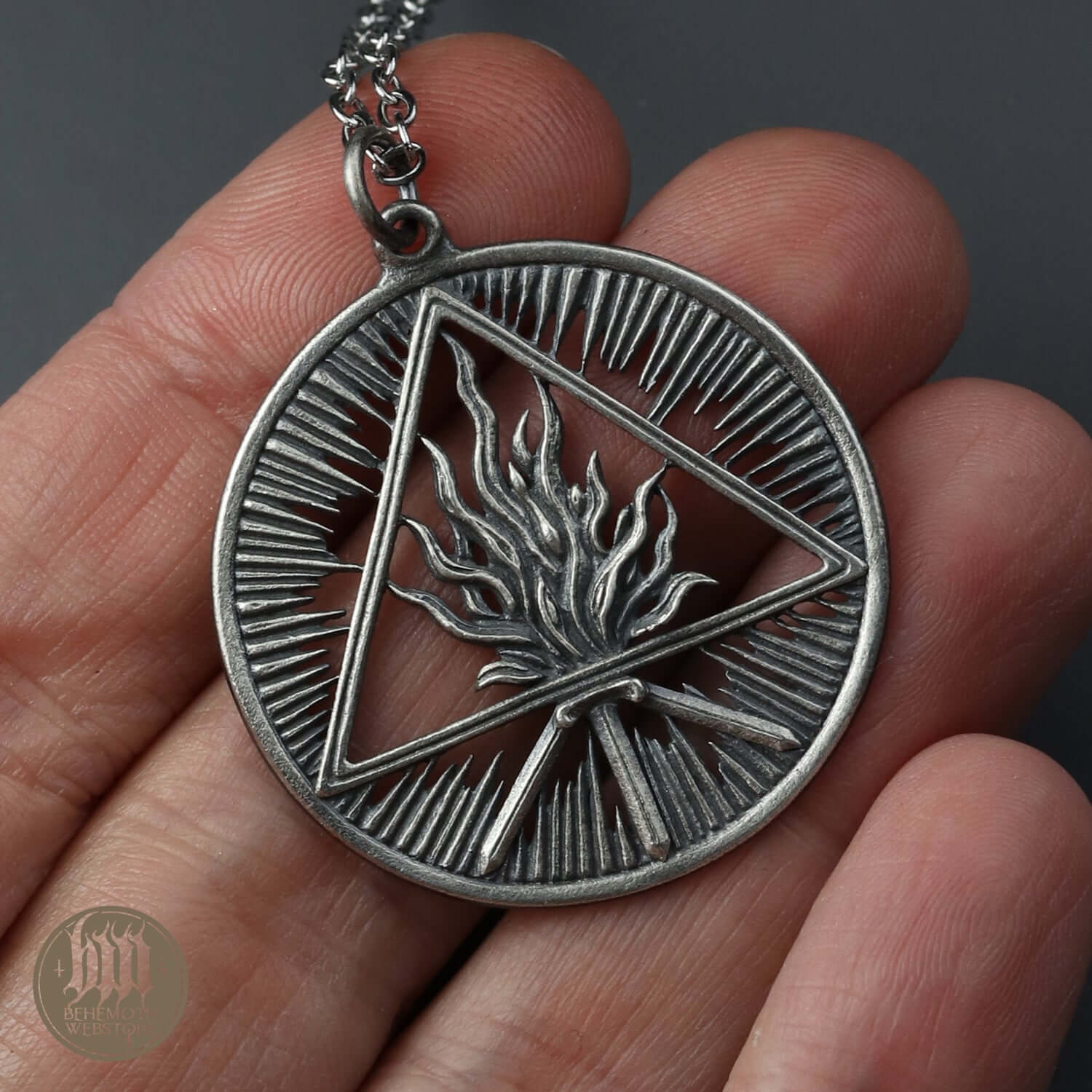 Sterling silver pendant with openwork Unholy Trinity design, featuring intricate details and oxidized finish, by Anna Mazon.