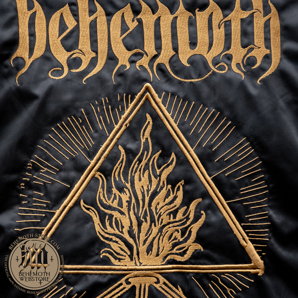 Dark gold embroidery of the Behemoth logo and The Unholy Trinity Sigil