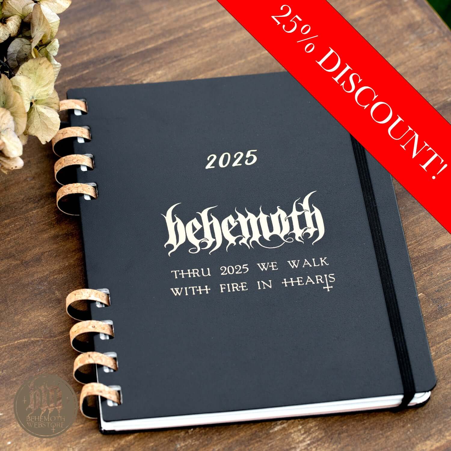 Behemoth 'Thru 2025 We Walk' Limited Edition Moleskine 2025 Calendar with a 25% discount banner, spiral binding on wooden background.