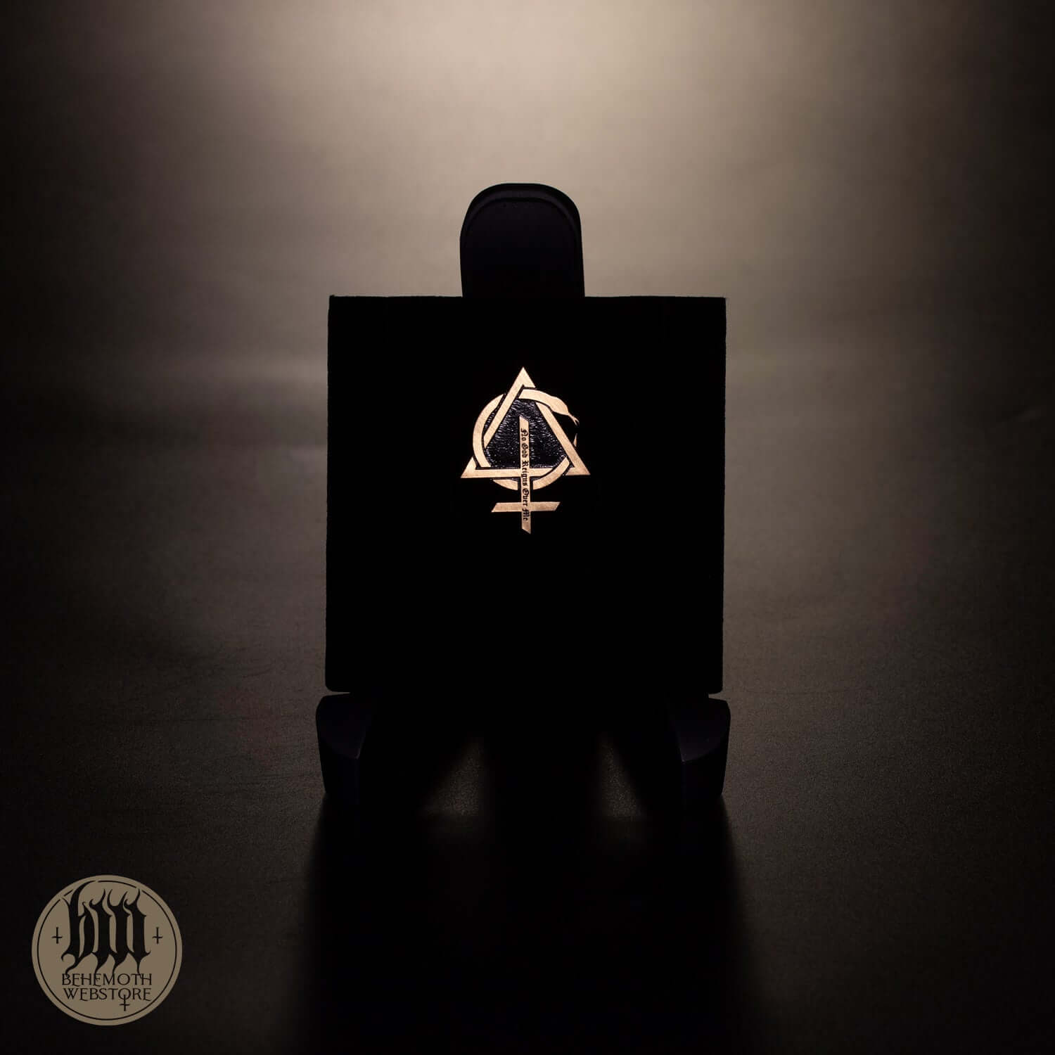 Behemoth 'Contra' cut out patinated brass pin with geometric design, 3.5 cm height, 3 cm width, displayed against a dark background.