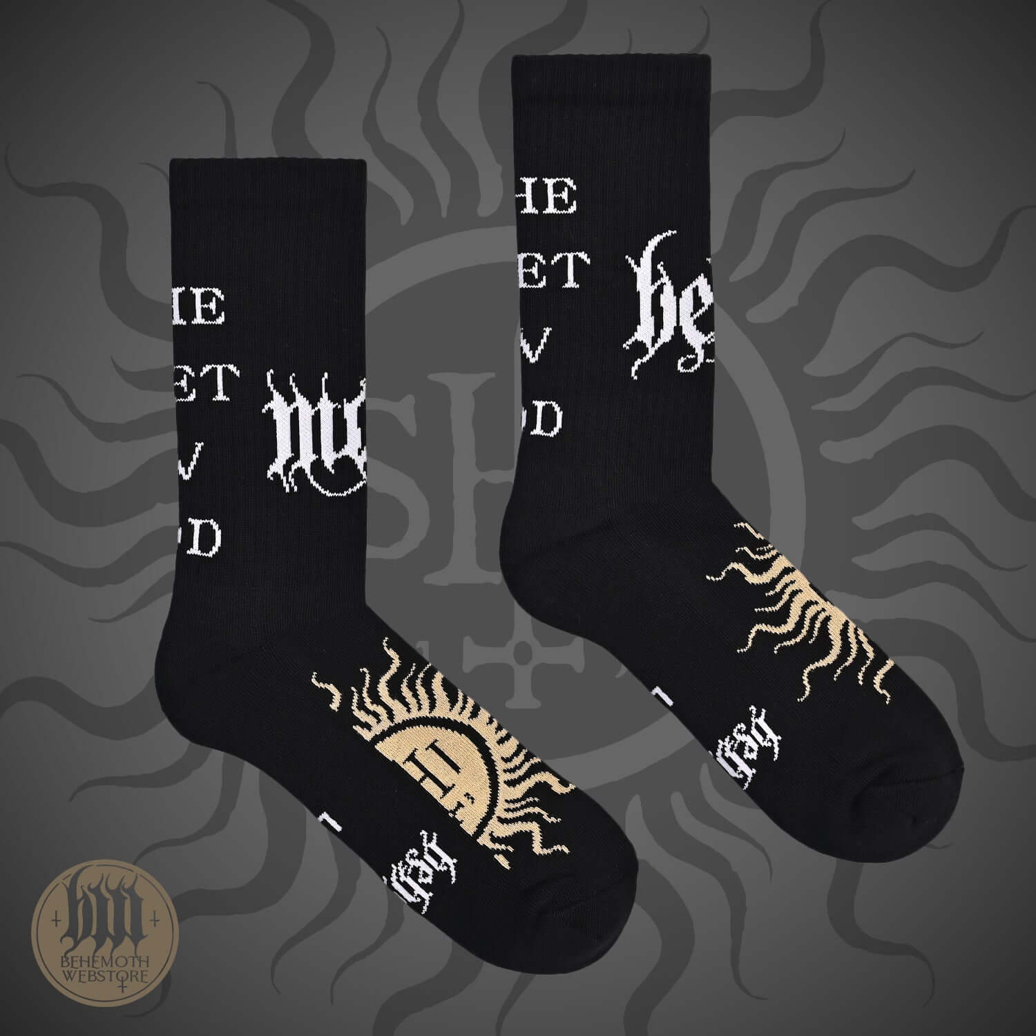 Behemoth 'The Feet Ov God' socks featuring logos and sigil, black mid-calf design with bold graphic elements on a dark background.
