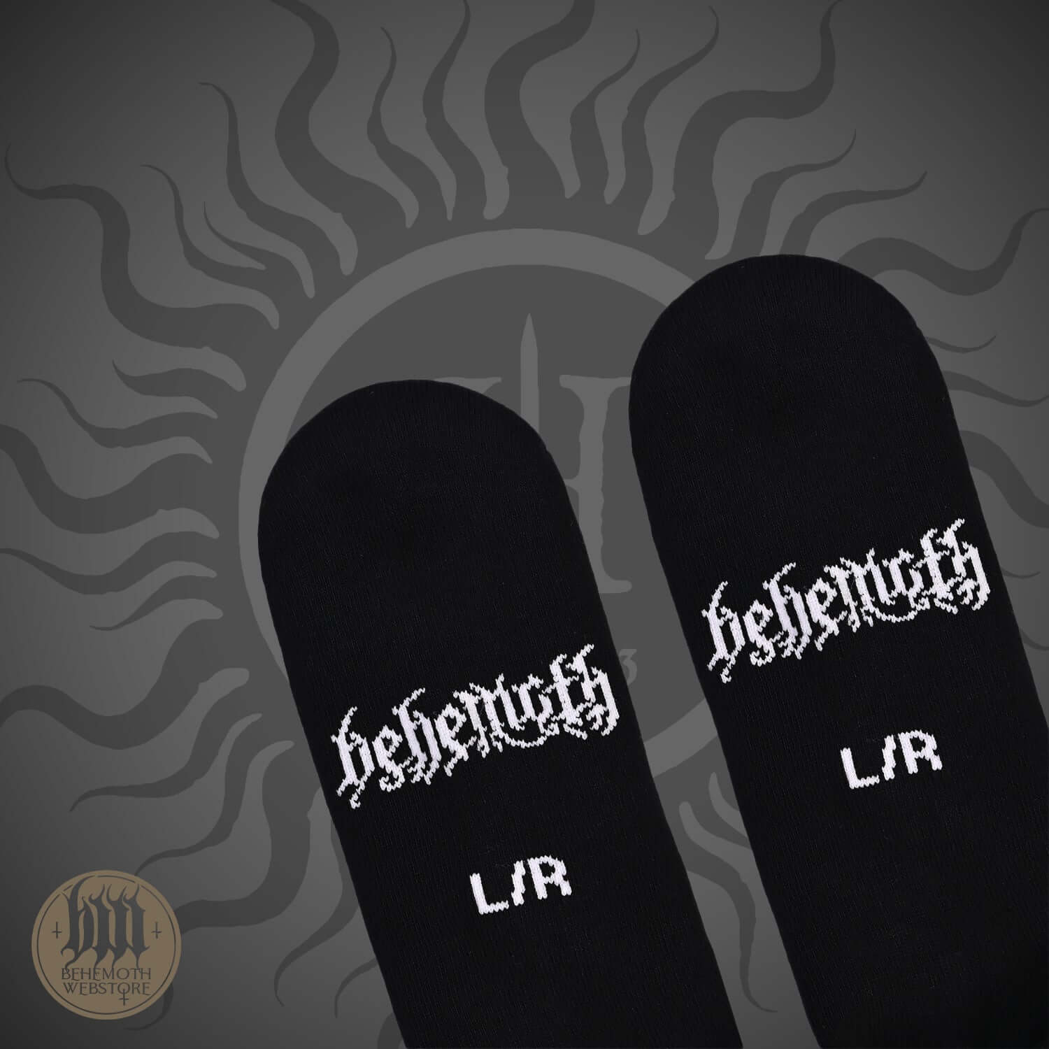 Black Behemoth socks with logo and L/R marking on textured dark background