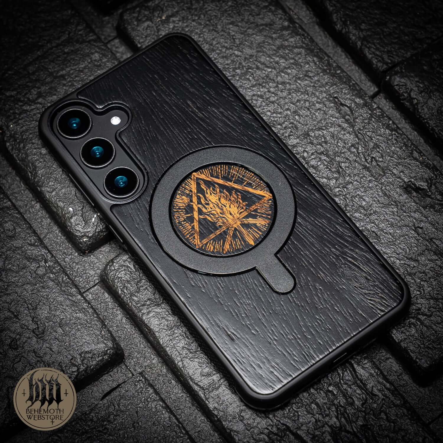 Behemoth 'Thru Fire We Walk' black oak MagSafe phone case with unique design, hand-finished for precision, made in Poland.