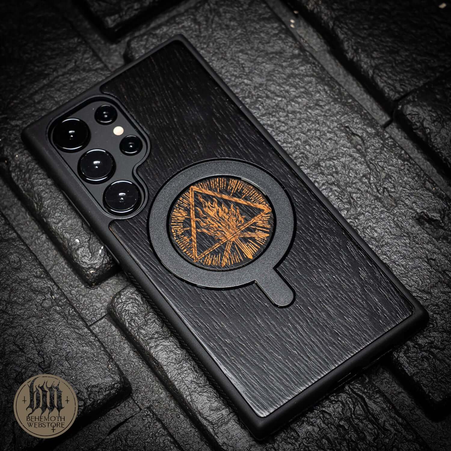Black oak MagSafe phone case with Behemoth 'Thru Fire We Walk' design, featuring silicone TPU finish, made in Poland.
