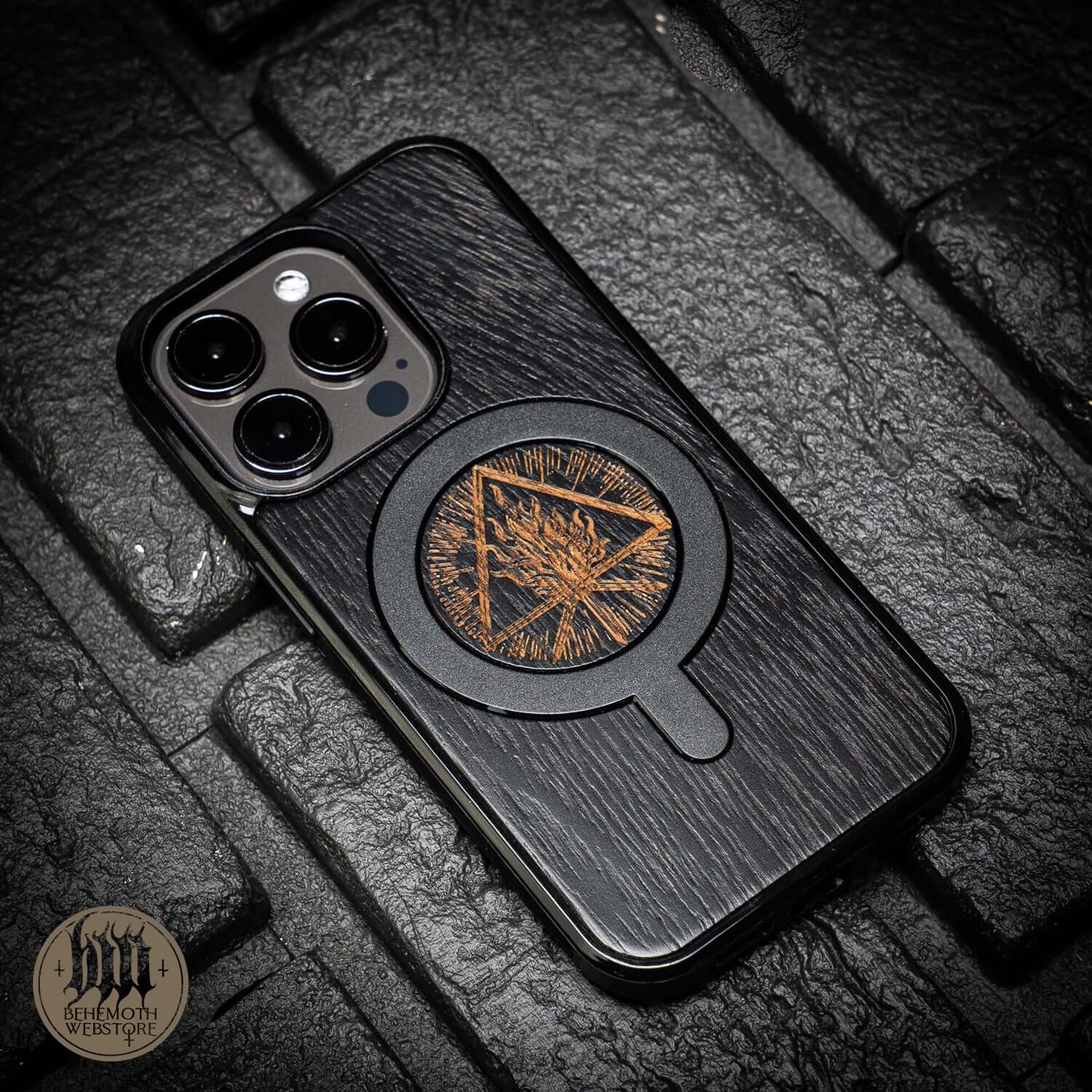 Behemoth 'Thru Fire We Walk' black oak MagSafe phone case with intricate design, handcrafted in Poland for iPhone.
