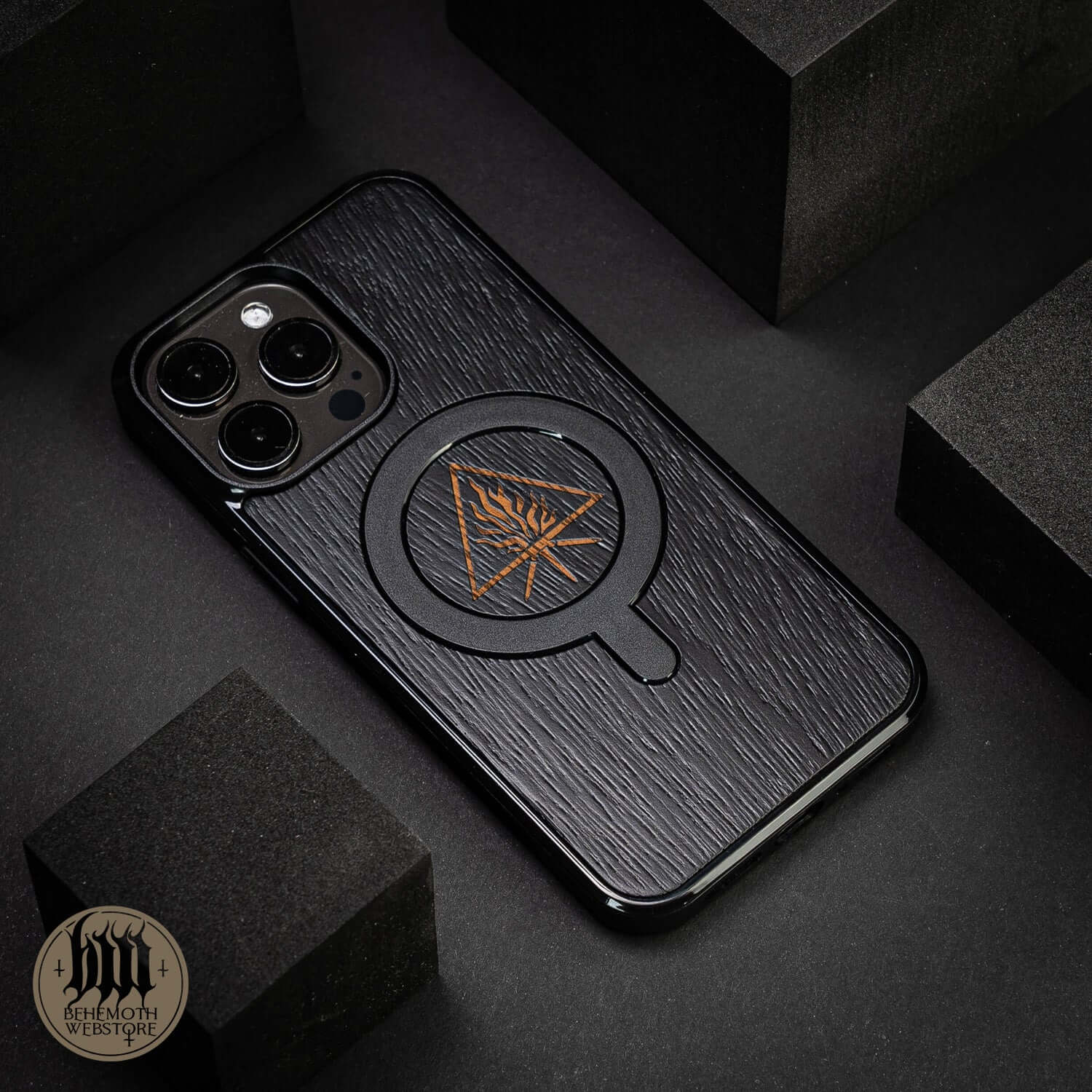 Behemoth 'The Unholy Trinity' black oak TPU MagSafe phone case with triangle design, hand-finished in Poland.