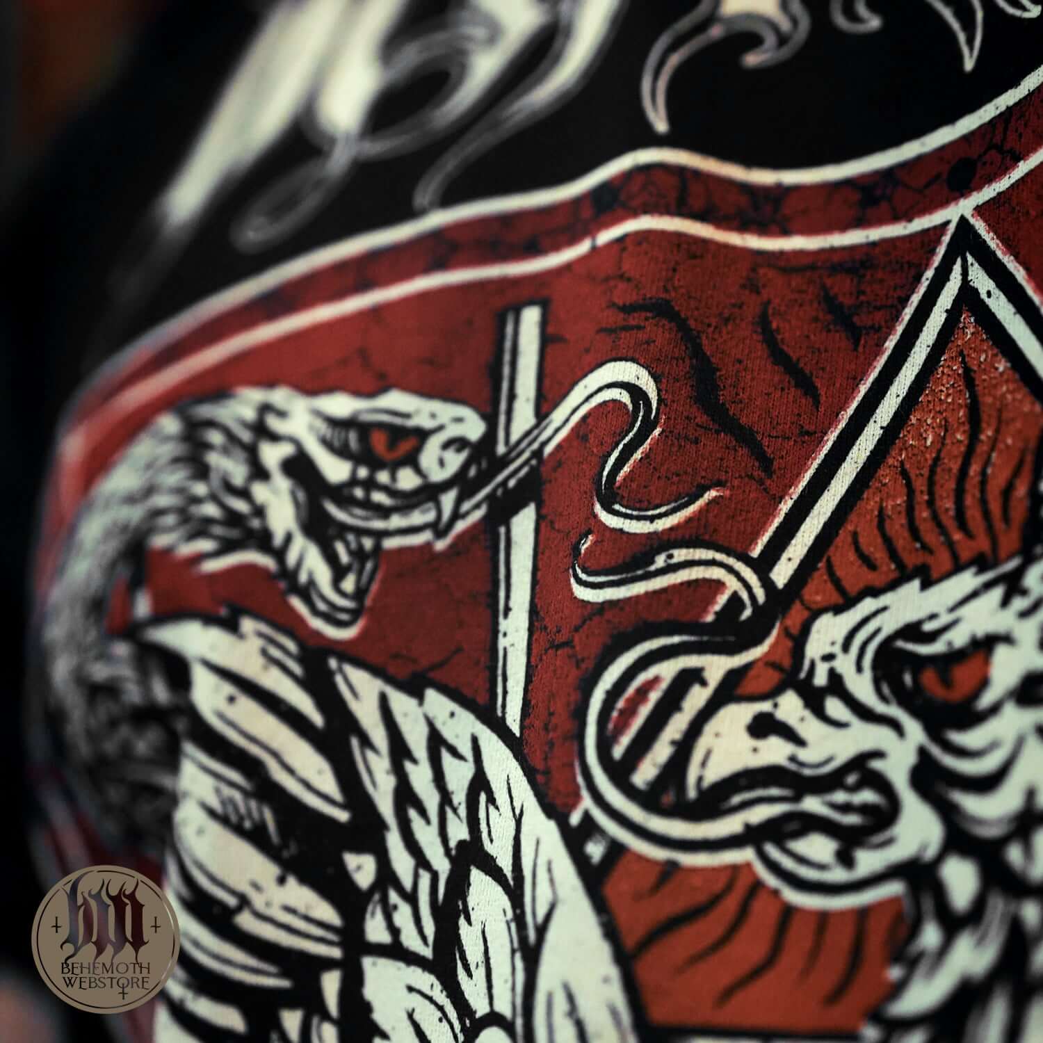 Close-up of 'The Republic Of The Unfaithful' Behemoth T-Shirt design featuring intricate serpent and beast illustrations symbolizing freedom.
