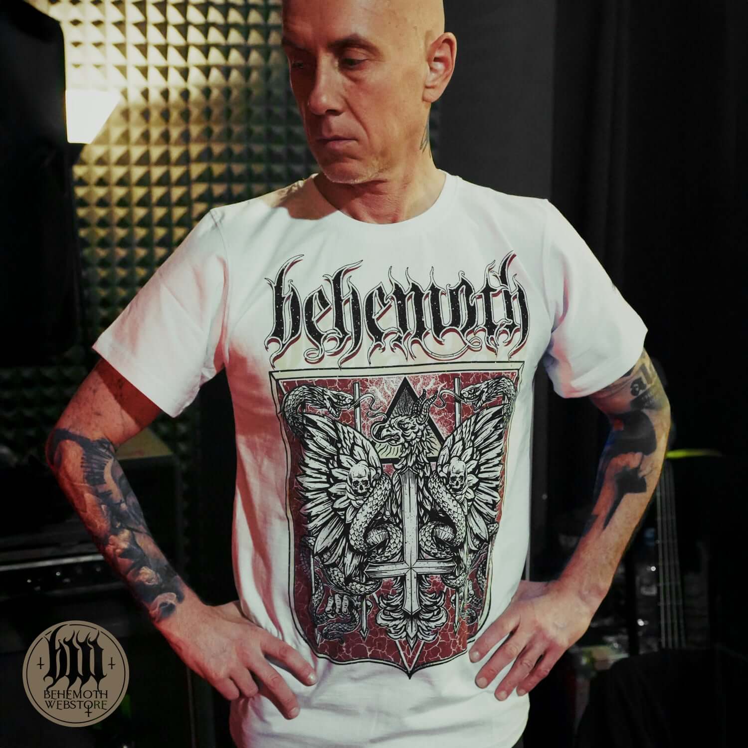 Man wearing 'The Republic Of The Unfaithful' Behemoth white t-shirt, symbolizing victory over censorship and freedom of expression.