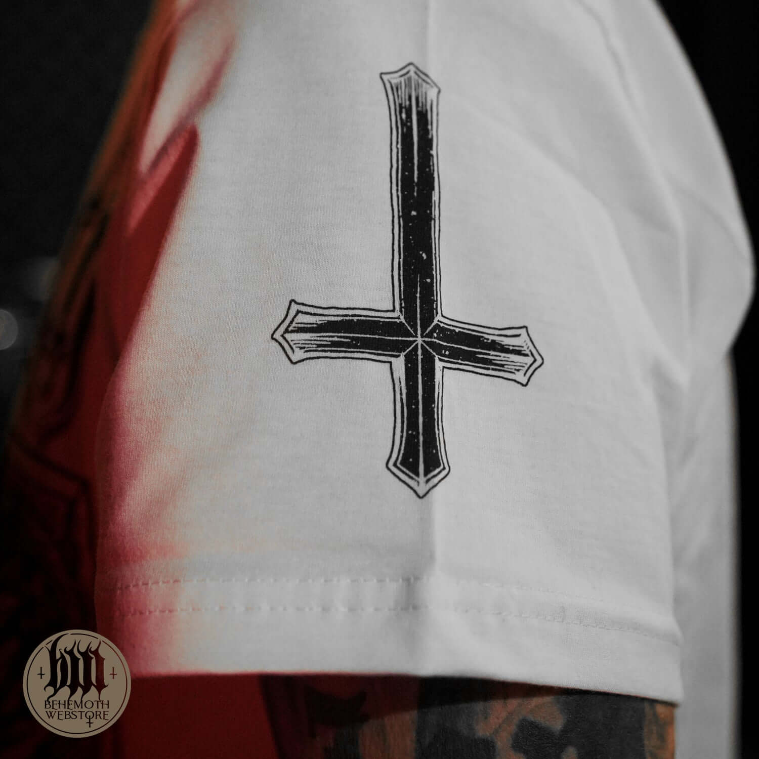 The Republic Of The Unfaithful Behemoth White T-Shirt with black cross symbol, representing freedom of expression and artistic victory.