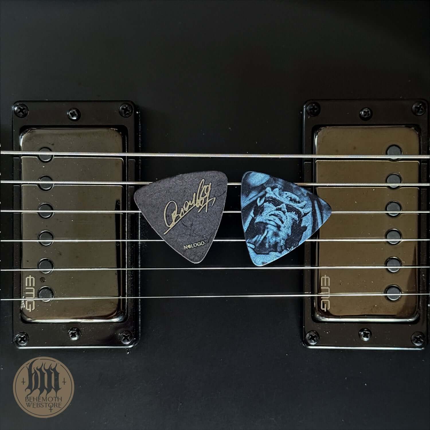 Orion signature TSOG Cover plastic guitar pick on strings, 0.88 mm thickness, ideal for musicians seeking precision and durability.