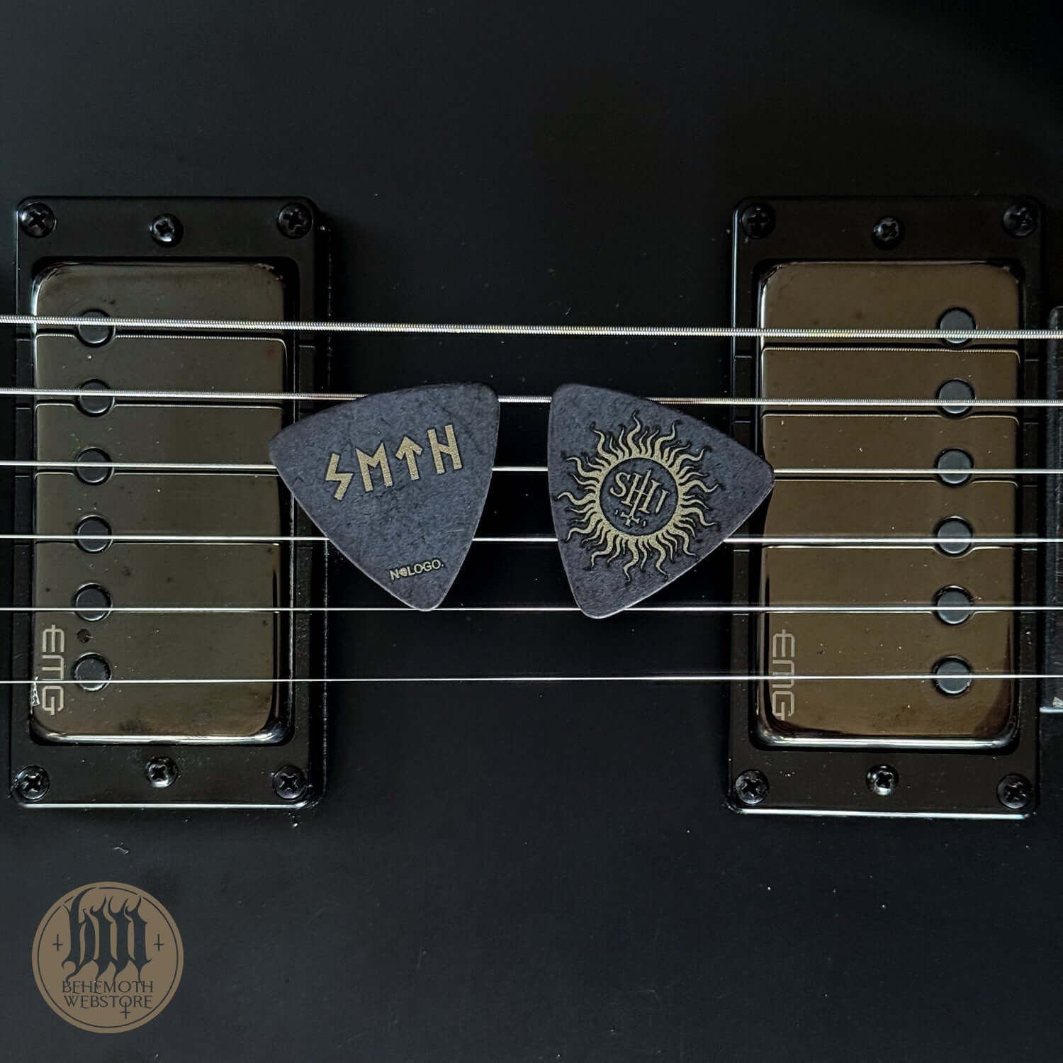Two signature guitar picks, including Seth's TSOG design, displayed on electric guitar strings, with 0.88 mm thickness.