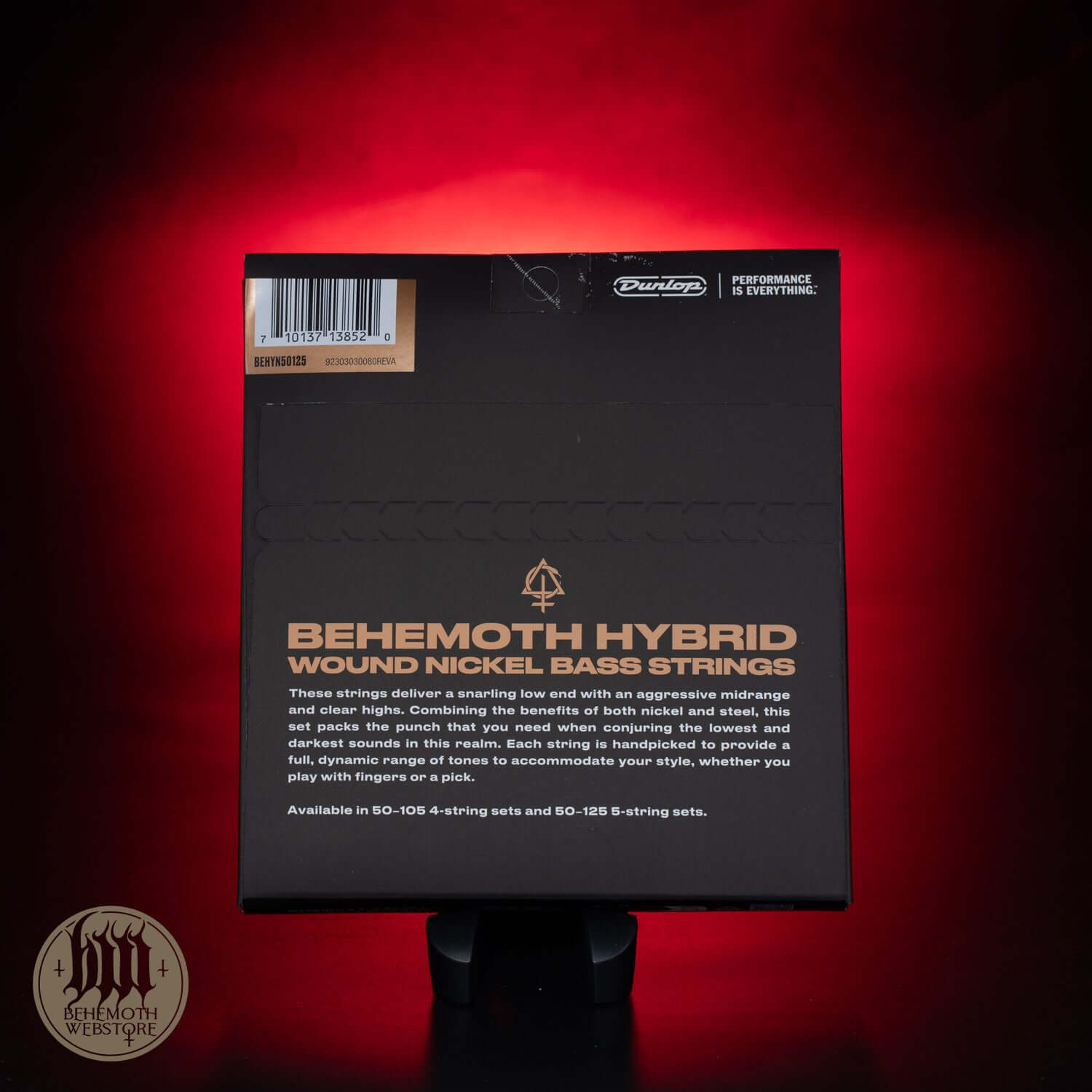 Back of Dunlop Behemoth Hybrid Nickel Bass Strings packaging against a red background.