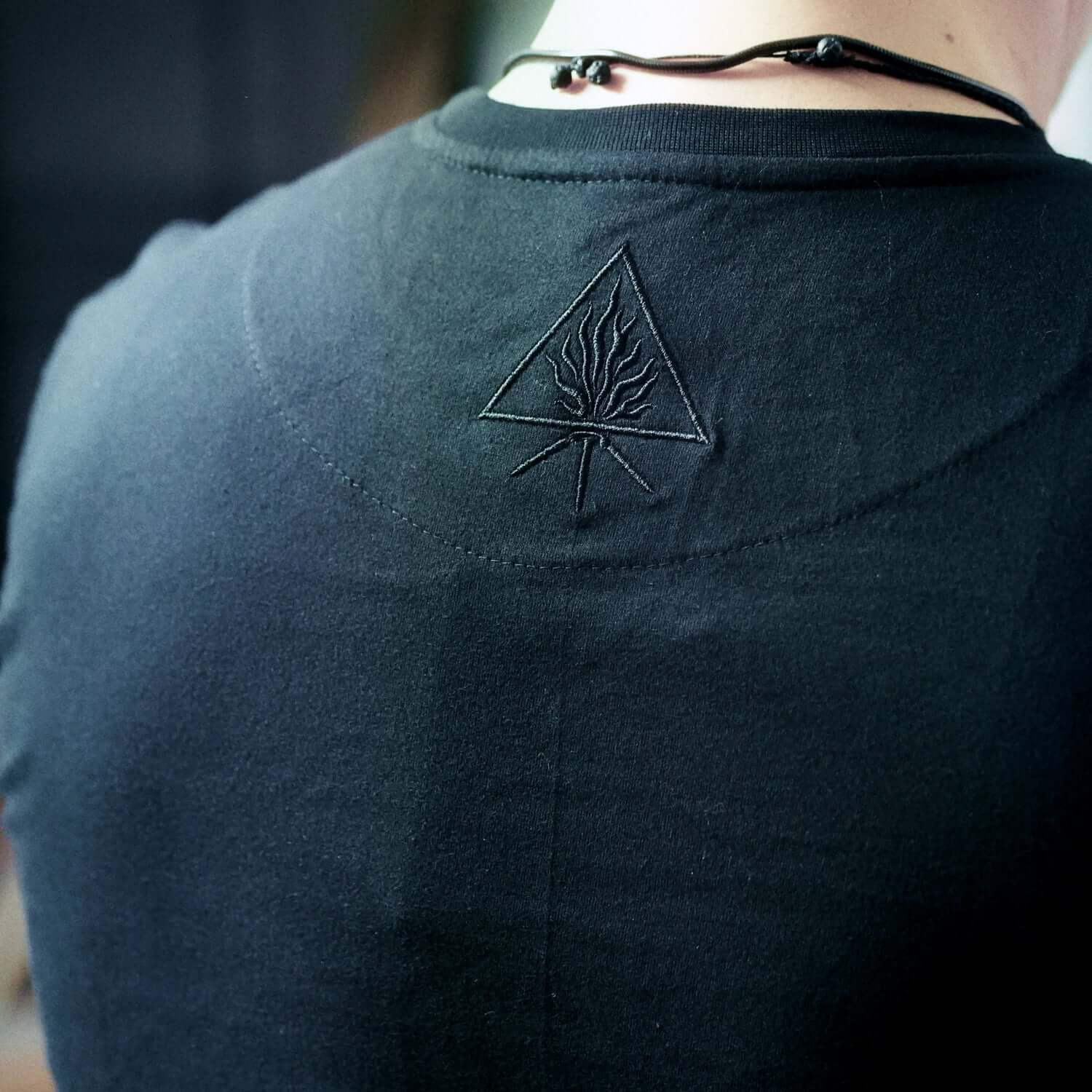 Back view of Behemoth 'The Satanist' T-Shirt featuring Unholy Trinity symbol embroidery, part of the Blackest Ov The Black collection.