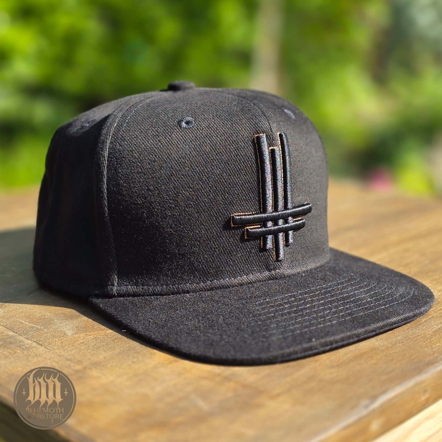 Behemoth 'Trivmviratvs' snapback cap with 3D embroidered logo, high-quality and adjustable, made in Poland, New Aeon Musick logo.