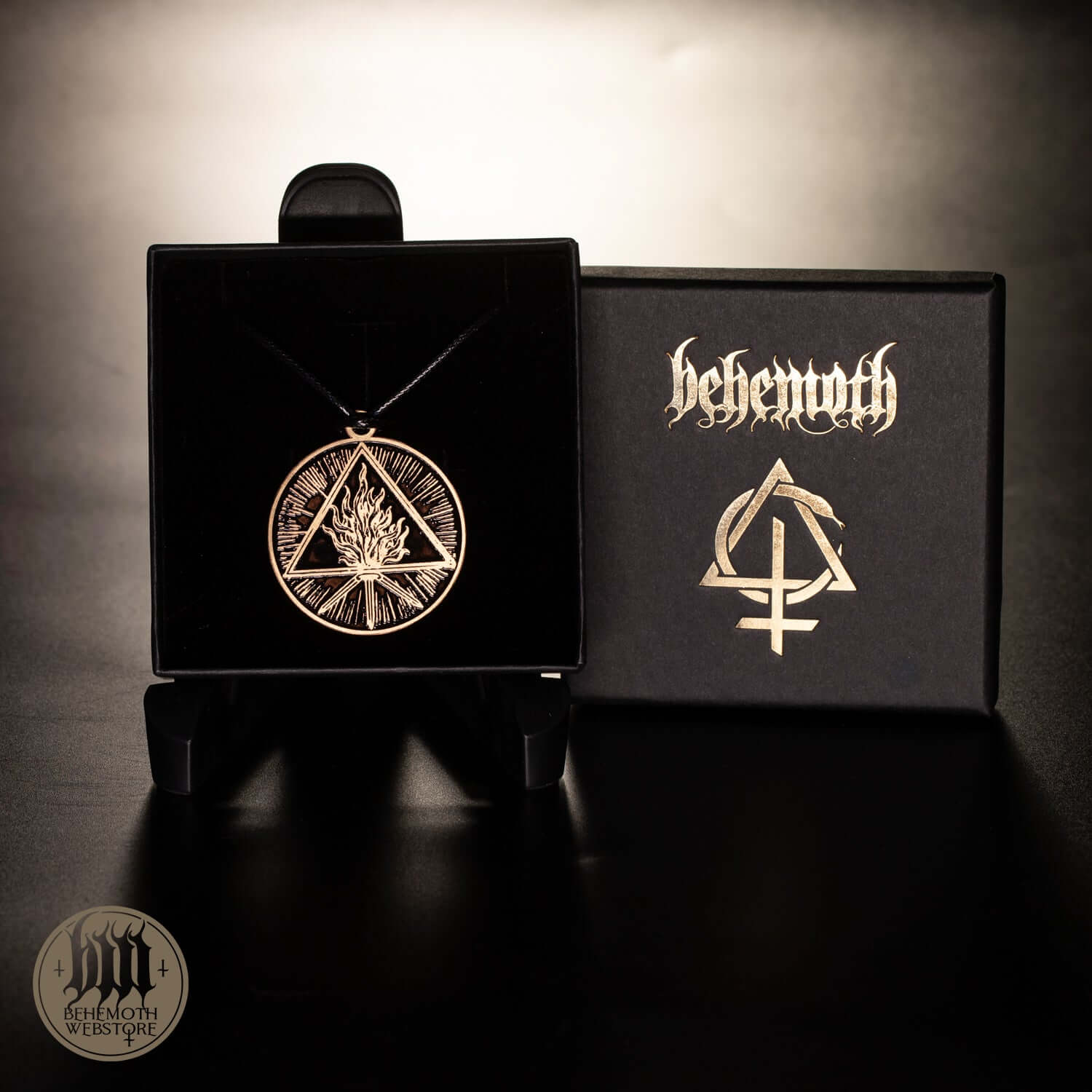 Behemoth 'The Unholy Trinity' patinated brass necklace with strap, displayed in a black box; diameter 4 cm (1.57 inches).
